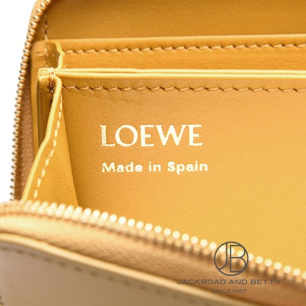 ノット ジップ アラウンド ウォレット ダークバター イエロー