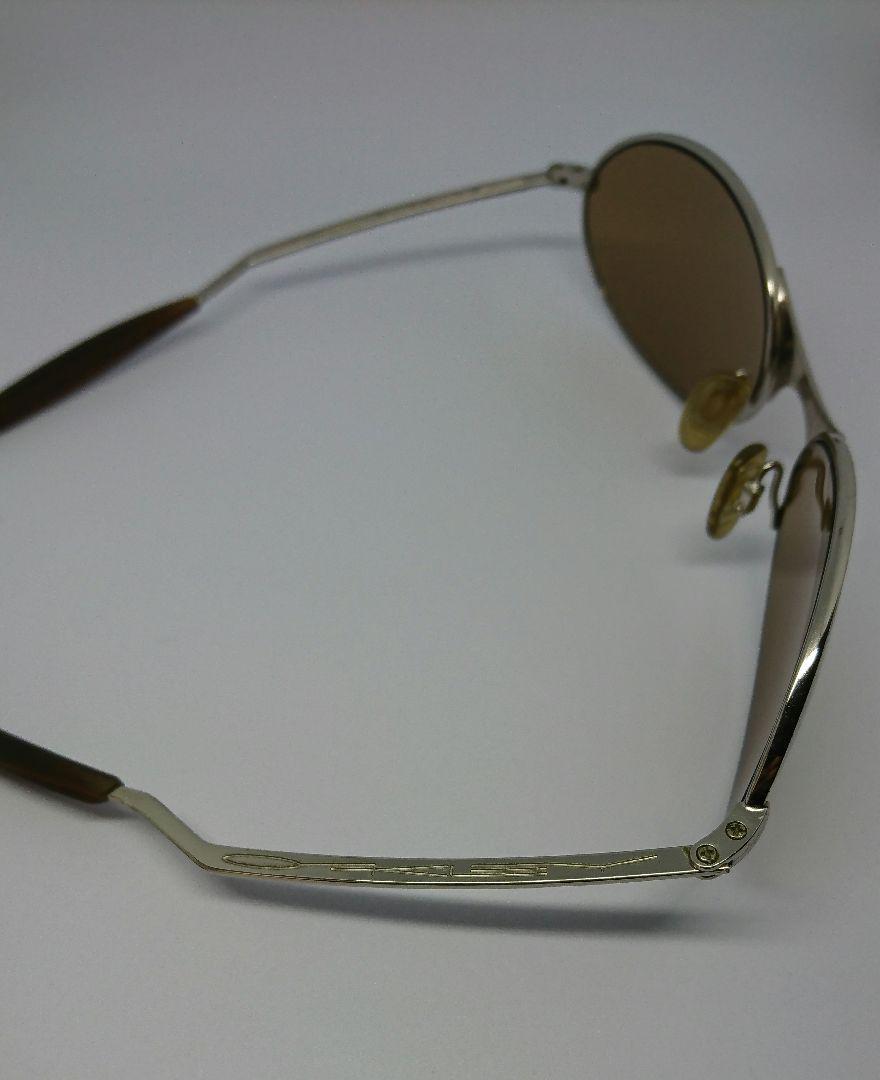 OAKLEY e-wire ['90s] Color: Gold (frame) x Brown (lens