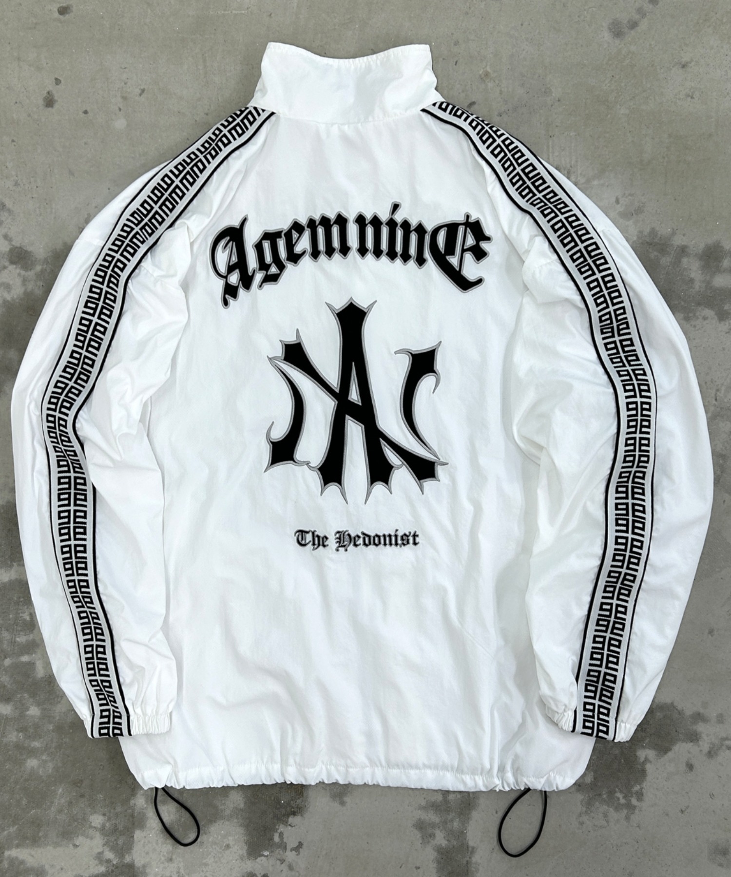 A'GEM/9 × .kom 『A'GEM/9/エージェムナイン』 ジャガードロゴナイロン