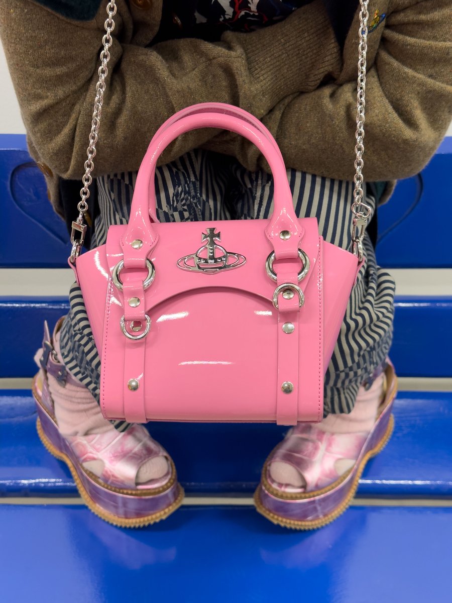 The patent finish of our Betty Mini handbag takes inspiration from