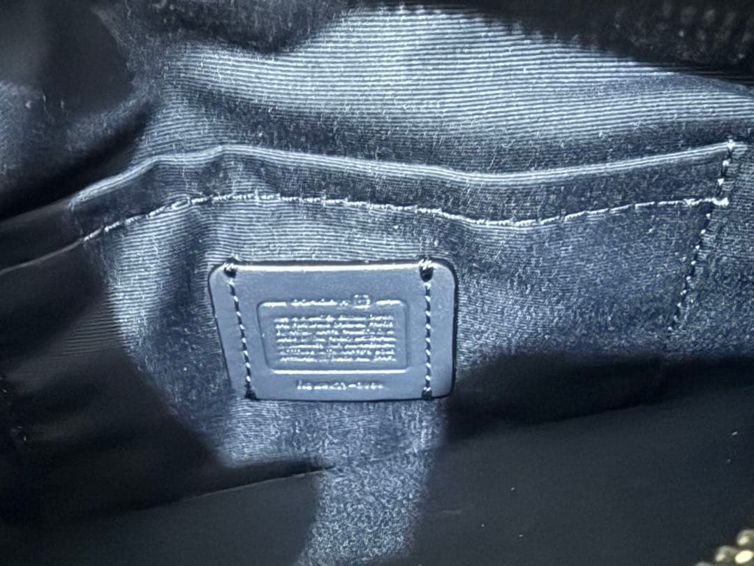 COACH フラワープリント ボディバッグ