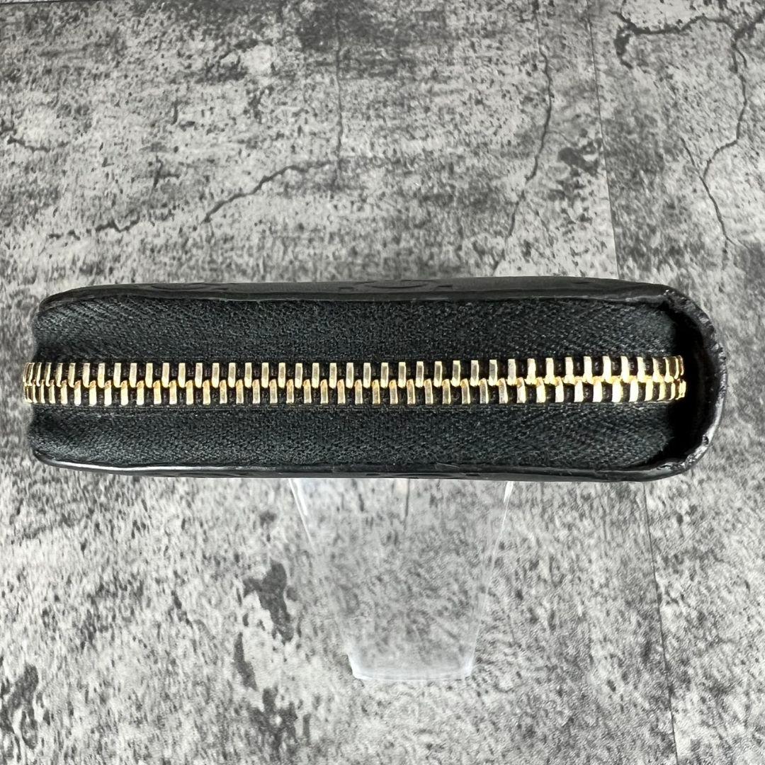 GUCCI GGエンボス インターロッキング リボン金具 ラウンド 長財布