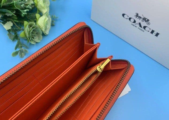 新品未使用コーチ長財布オレンジロングジップレディースメンズ送料無料即日発送
