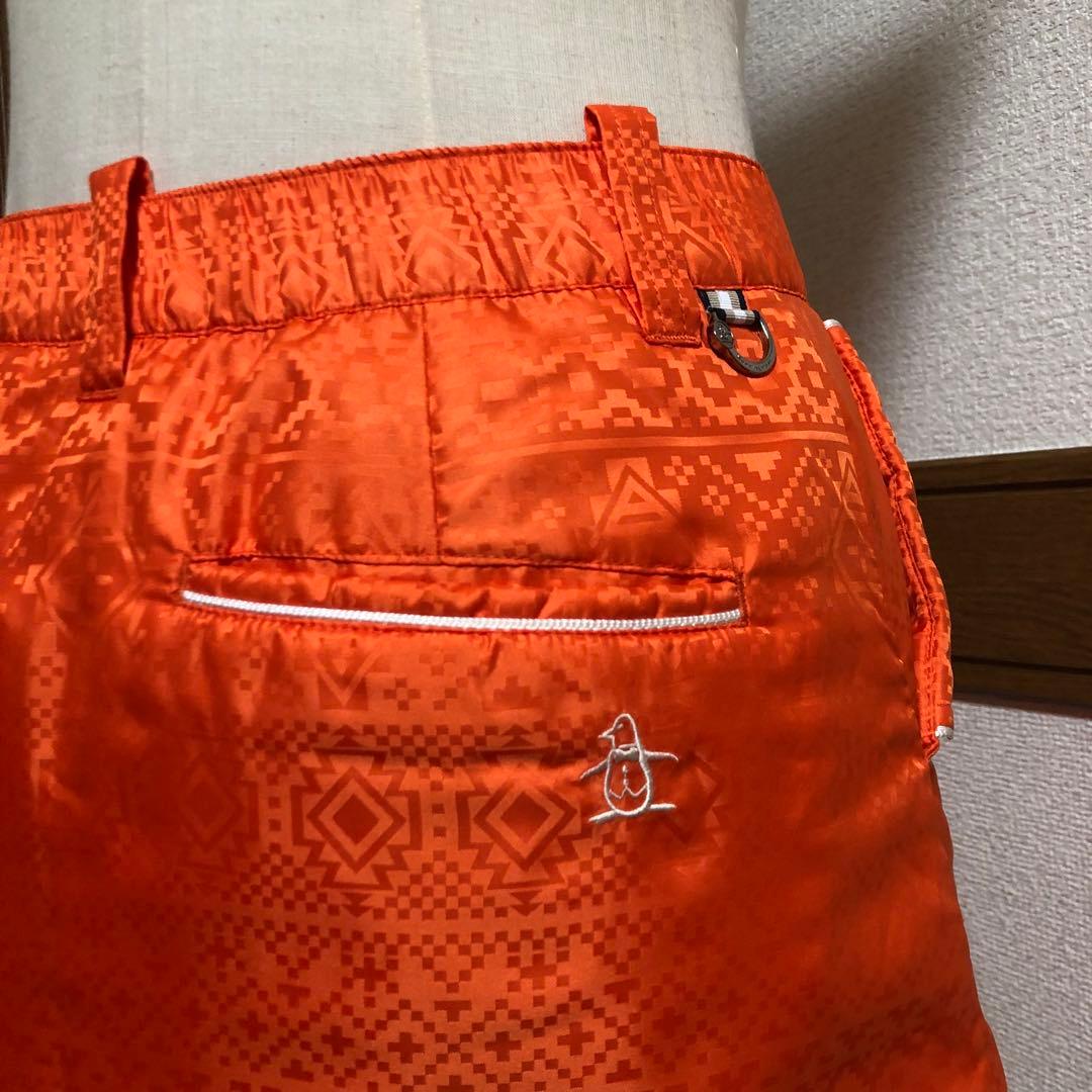 セットアップ マンシングウェア 中綿 パーカー スカート オレンジ 総柄