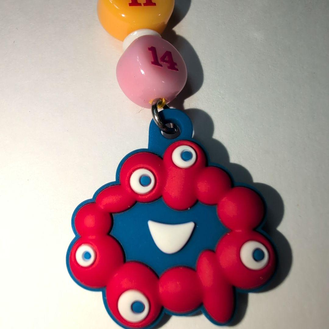 ミャクミャク バースデーストラップ - メルカリ