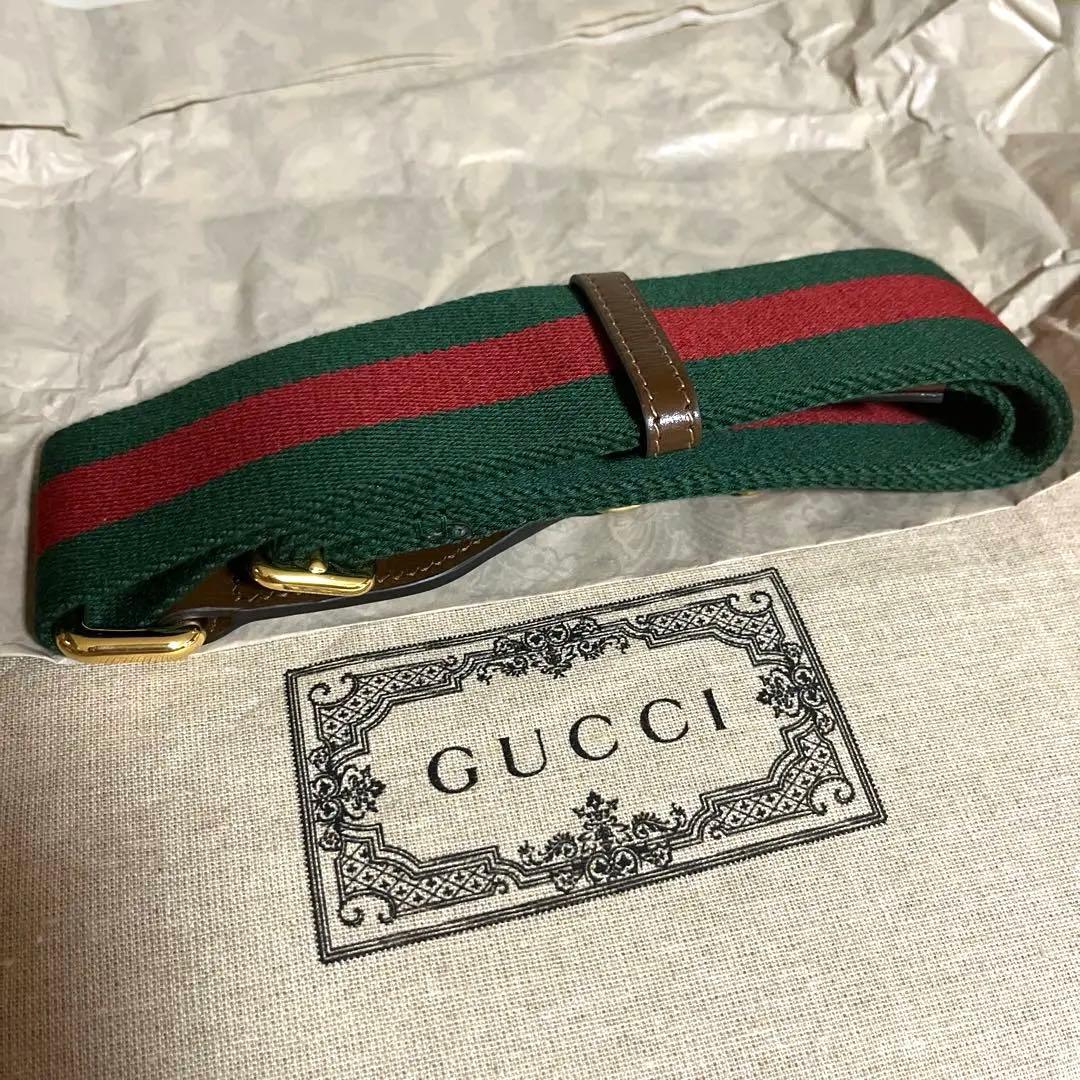 〈新品〉GUCCIのグリーンとレッドのストラップベルト リネン製ロゴ入り巾着袋付