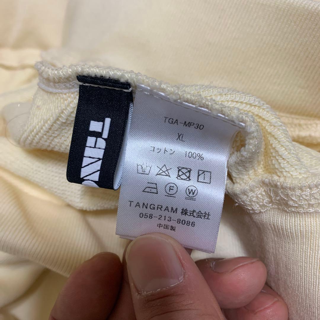 TANGRAM クリーム色パンツ