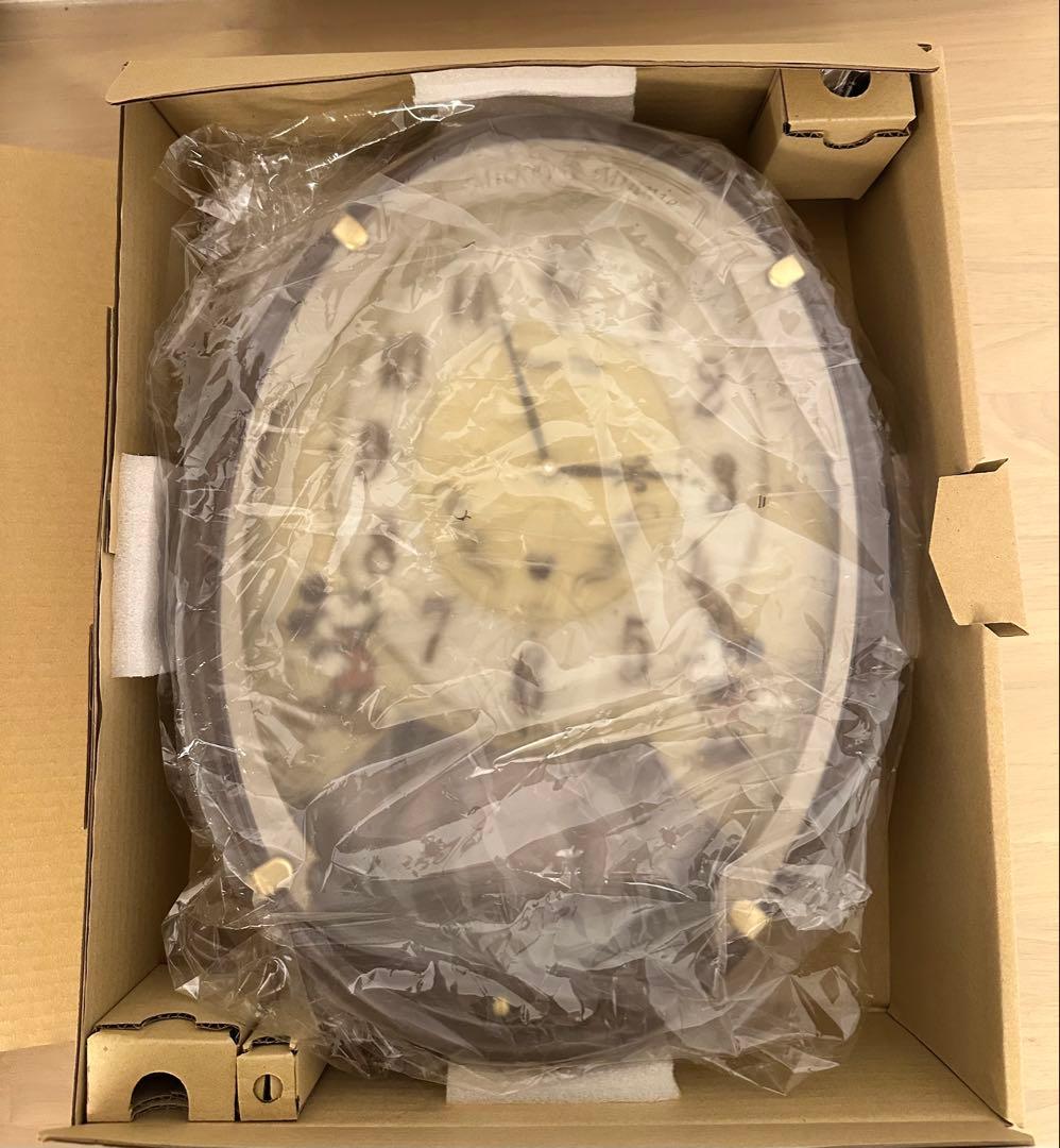 ミッキーとミニー シルエットの飾り振り子が魅力 メロディ付き掛時計