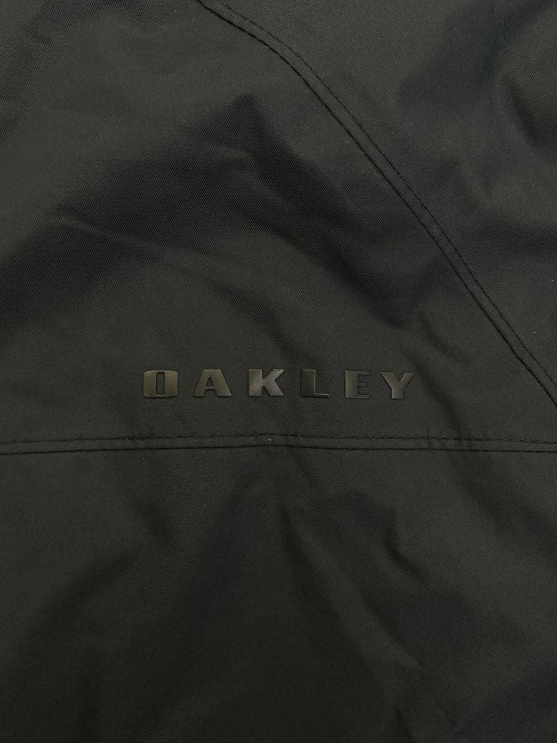 G601　オークリー　ゴルフメンズウェアジャケット　フード付き　サイズS/P　黒