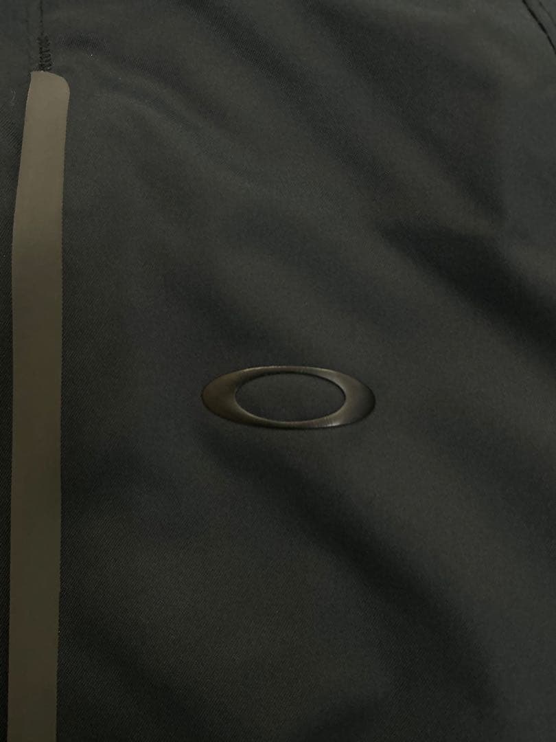 G601　オークリー　ゴルフメンズウェアジャケット　フード付き　サイズS/P　黒